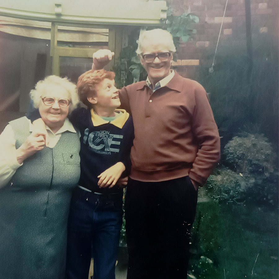 James and his grandparents in their garden